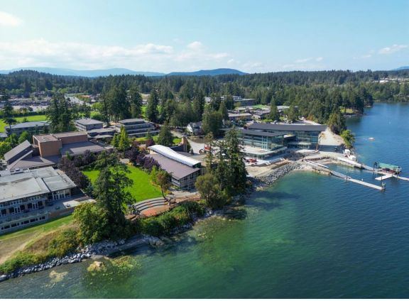 View of oceanfront private school campus along the shore on a sunny day