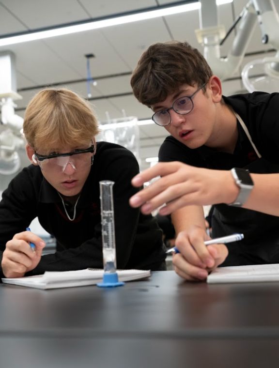 Two boys running an experiment in the Science Superlab