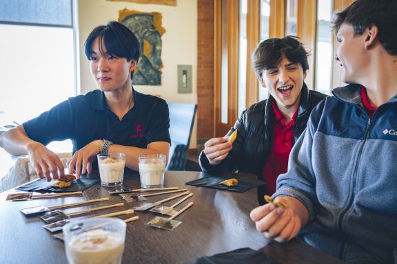 Boys laughing and enjoying treats in McNeill's Student Centre