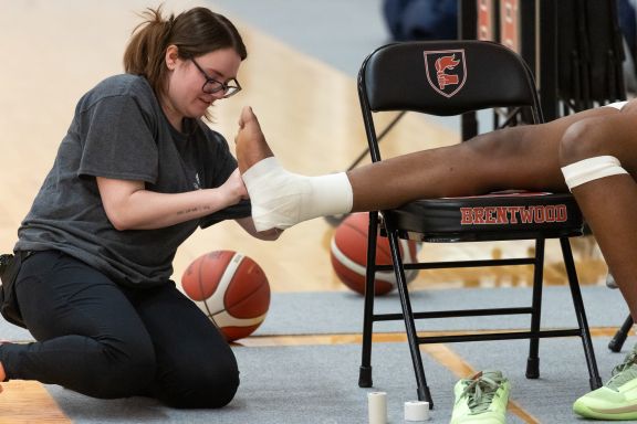 Mid-game athletic therapy is part of private school athletics at Brentwood