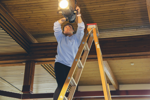 A student working on a light