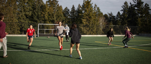 A team playing flag football on the Brentwood turf